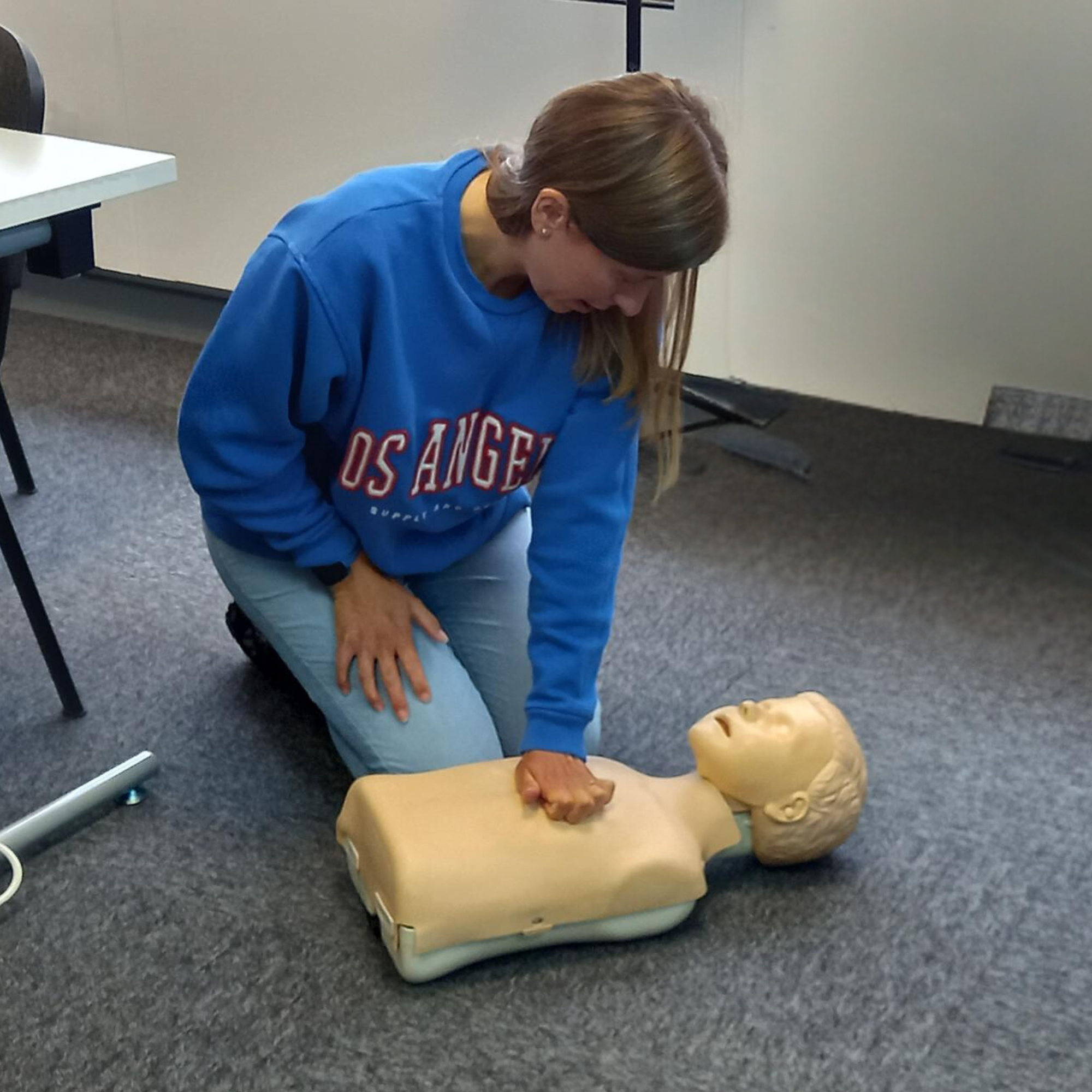 Amy in training with a paediatric first aid doll